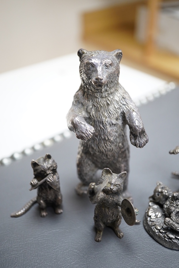 An Elizabeth II silver four piece miniature cat band by S.J. Rose & Son, Birmingham, 1976, tallest 58mm, together with a modern 925 miniature model of a standing grizzly bear and a modern silver model of a kitten(filled)